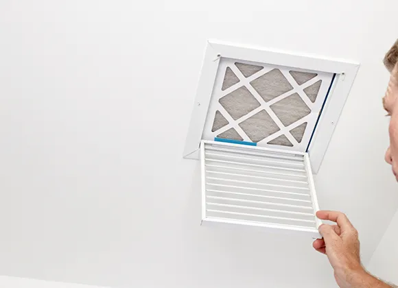 Professional airflow efficiency optimization by adjusting residential air vent grille in Manitowoc WI.