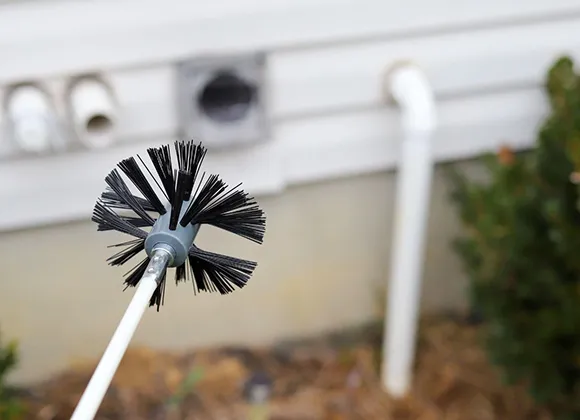 Specialized brush tool for thorough cleaning during dryer vent safety inspection in Fond Du Lac WI.