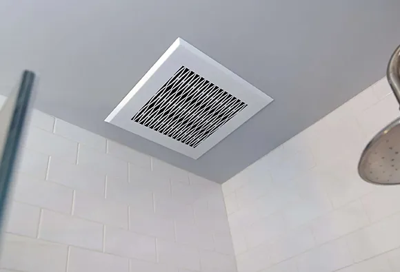 Deep cleaning of bathroom vent fan installed on ceiling in Sheboygan WI for optimal ventilation.