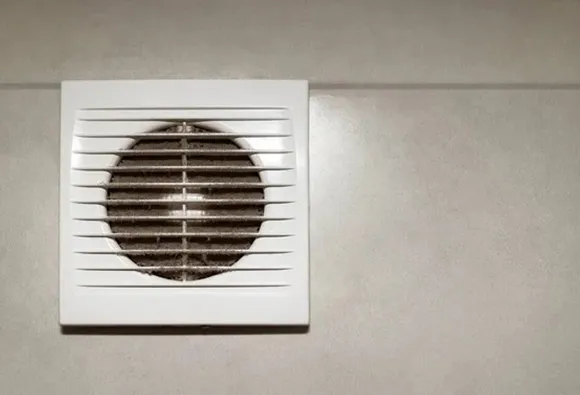 Clean bathroom fan vent cover for expert bathroom fan cleaning ensuring proper ventilation.