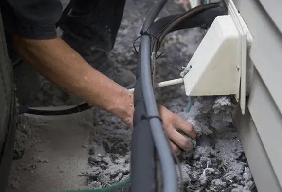 Expert dryer vent cleaning performed by technician in Manitowoc WI to prevent fire hazards.