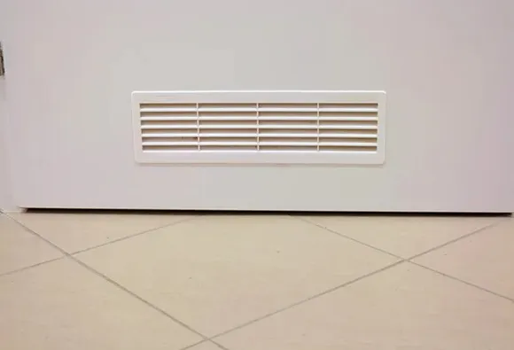 Clean white floor vent grille for HEPA-certified air duct cleaning service providing superior filtration.