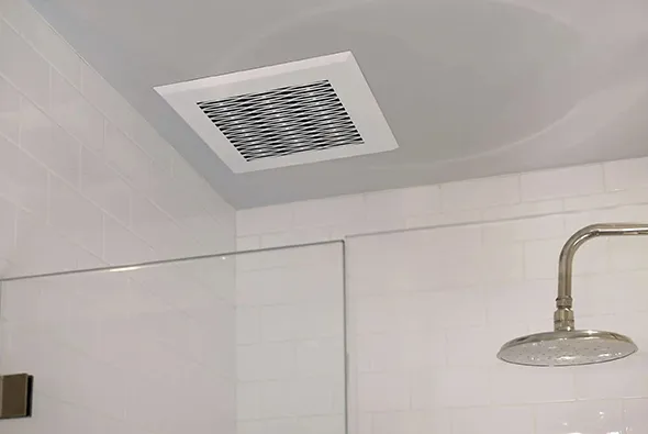 Reliable bathroom vent grille installed on white ceiling with maintenance service in Manitowoc WI.