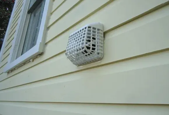 Reliable dryer vent maintenance showing exterior vent cover for safe dryer operation in Manitowoc WI.