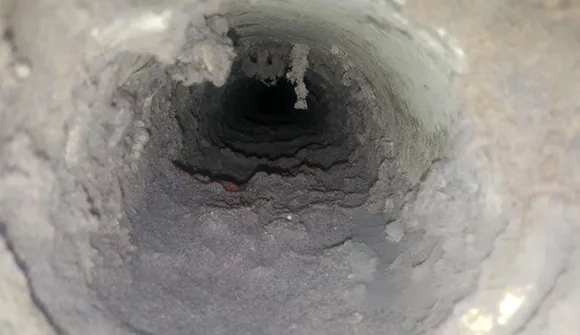 Dust and debris buildup inside air duct requiring emergency air duct cleaning in Manitowoc WI.