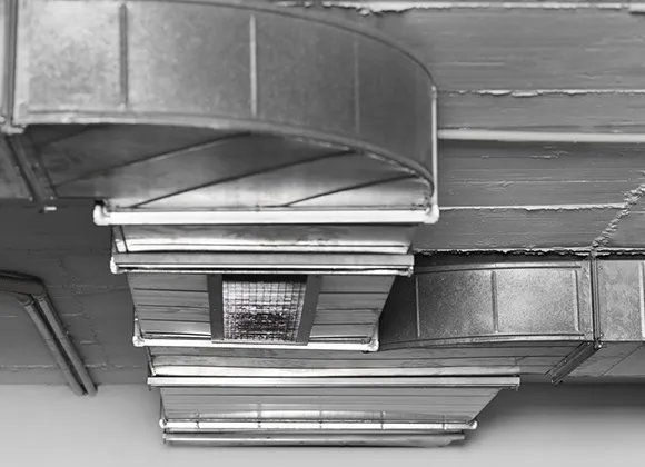 Industrial HVAC duct system with metal vents showing commercial air duct cleaning in Fond Du Lac WI.