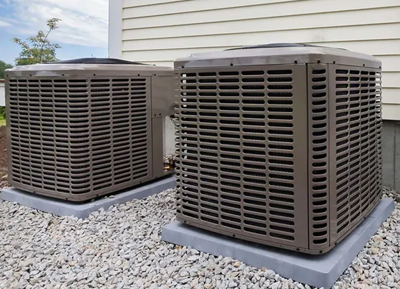 Outdoor HVAC condenser units near home, illustrating thorough mold removal service in Fond Du Lac WI.
