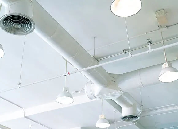 Top-rated commercial air duct cleaning experts servicing large building HVAC system in Oshkosh WI.